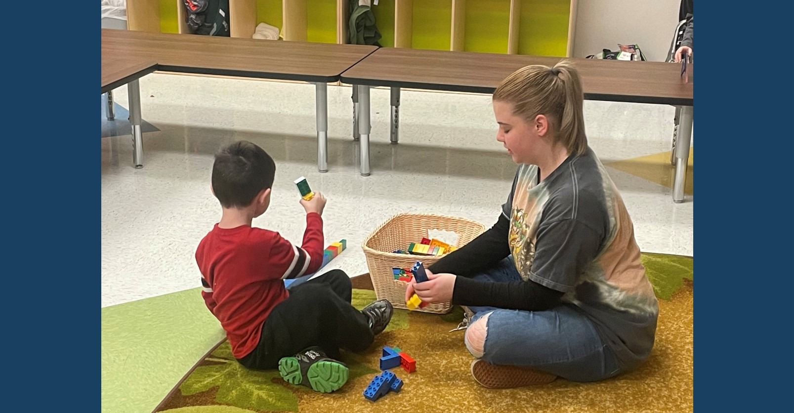 Aislinn Canavan spends time with a student of Carroll's Littlest Learners Child Development Center.
