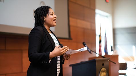 Woman speaking at a corporate event