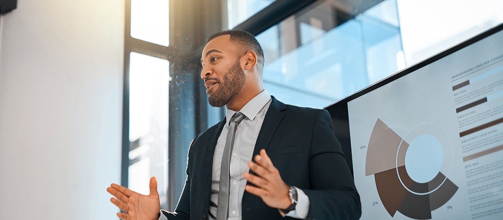 data science professional speaking in front of chart