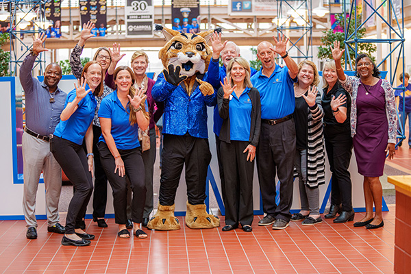 Group waving at Carroll Community College