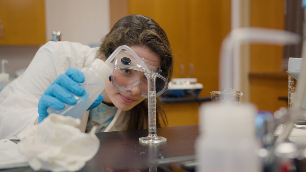 Major of the Month Student Pouring Chemicals Carroll Community College