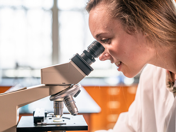Major of the Month Science Girl with Microscope Carroll Community College